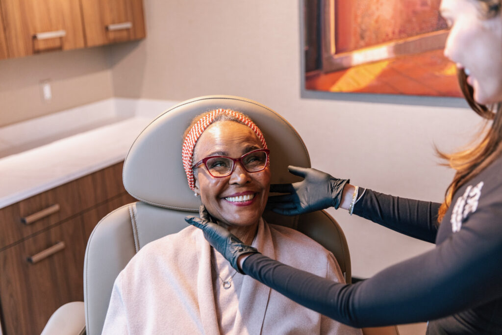 botox-treatment-patient-boyd-medspa-metro-detroit BOYD Med Spa aesthetic injector assessing a patient's face for Botox treatment in Metro Detroit